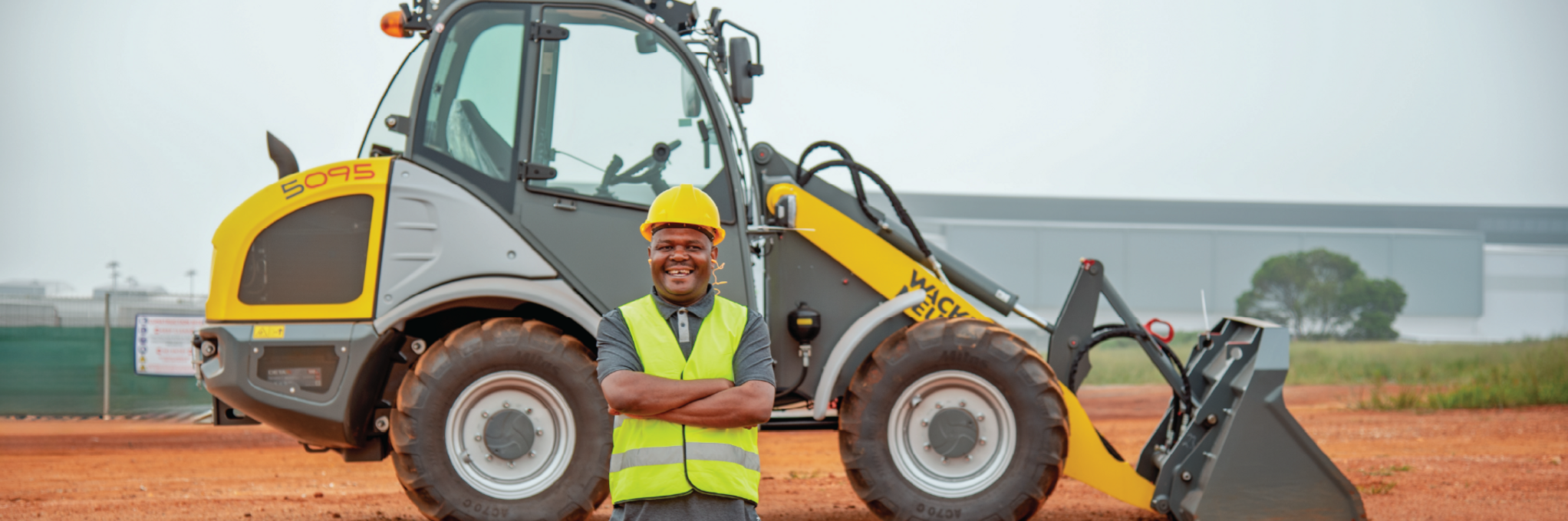 smiling colleague with 5095 wheel loader
